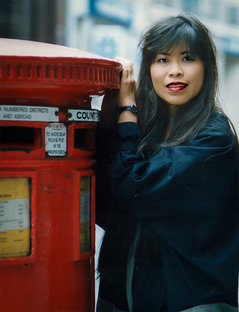 Girl with long hair, modelling by London-post-box